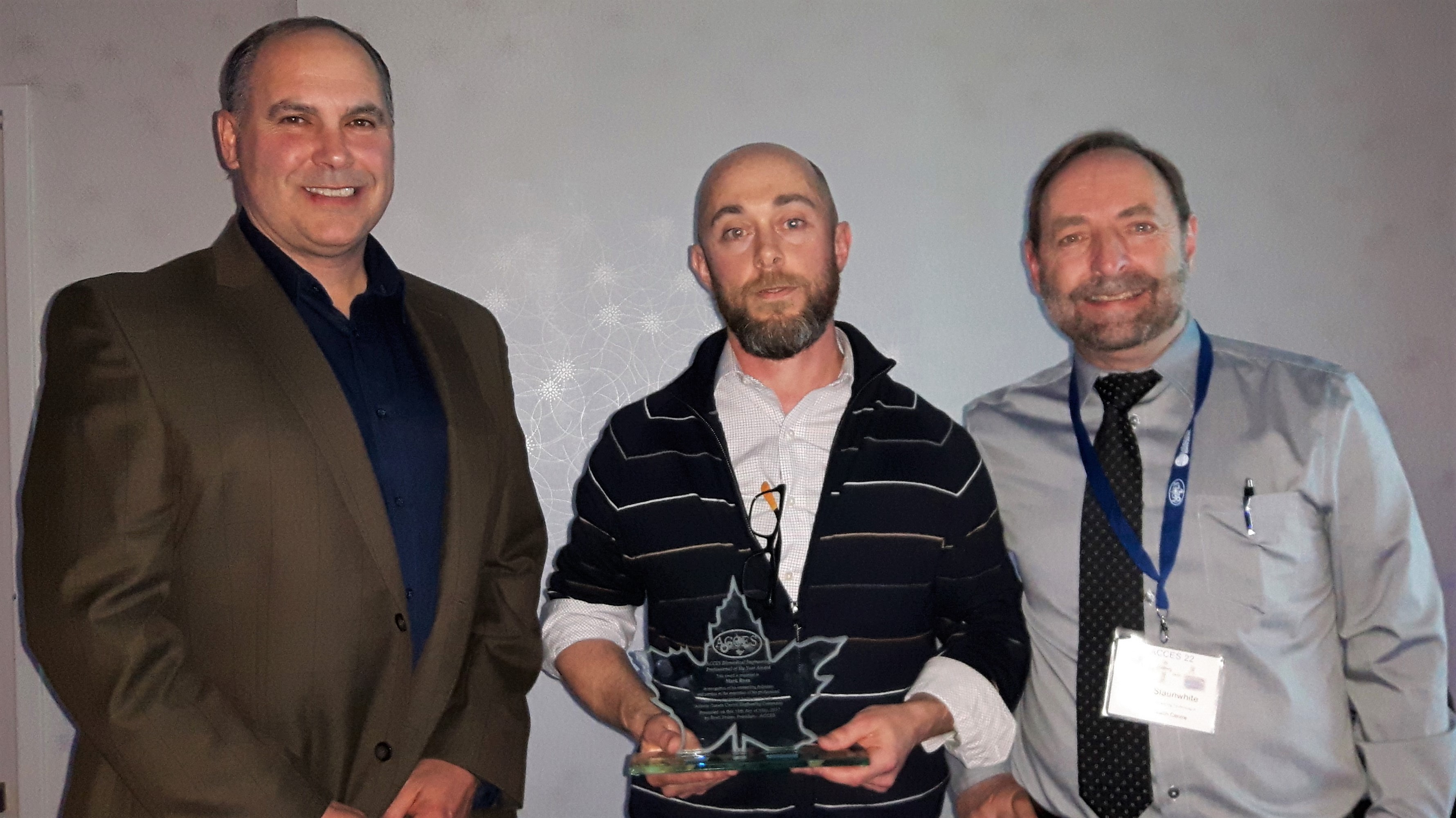 Brett Fraser, ACCES President; Mark Ryan, recipient of the 2017 ACCES Clinical Engineering Professional of the Year award; Gary Slaunwhite, ACCES Director of Membership Brett Fraser, ACCES President; Mark Ryan, recipient of the 2017 ACCES Clinical Engineering Professional of the Year award; Gary Slaunwhite, ACCES Director of Membership